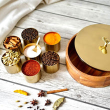 Load image into Gallery viewer, Wood and Stainless Steel (Gold Color) Round Masala Dabba Box with 7 Containers and Mini Spoon, Measures 9-inches Wide x 3-inches Tall
