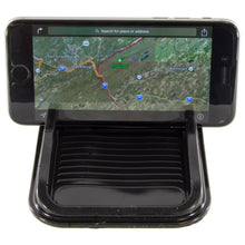 Load image into Gallery viewer, Holds smartphones up horizontally for hands-free visibility while driving | Works with most models of phones including iPhone and Samsung Galaxy | Clings to any automobile dashboard, stays in place without magnets or adhesives | Washable, Removable, and Reusable | Can also be used to store small items such as pens or coins
